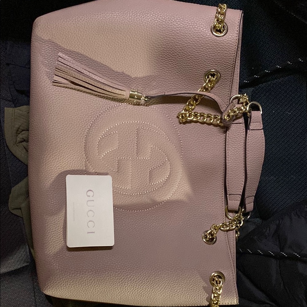 Gucci Pink Leather bag. Brand new. 
See last photo for small nic in leather